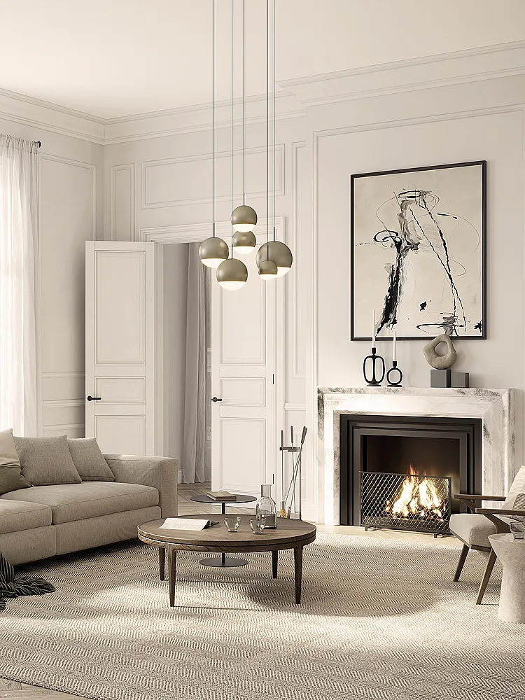 Elegantes Wohnzimmer mit Kamin, beiger Couch und modernen Lampen, warme Atmosphäre.