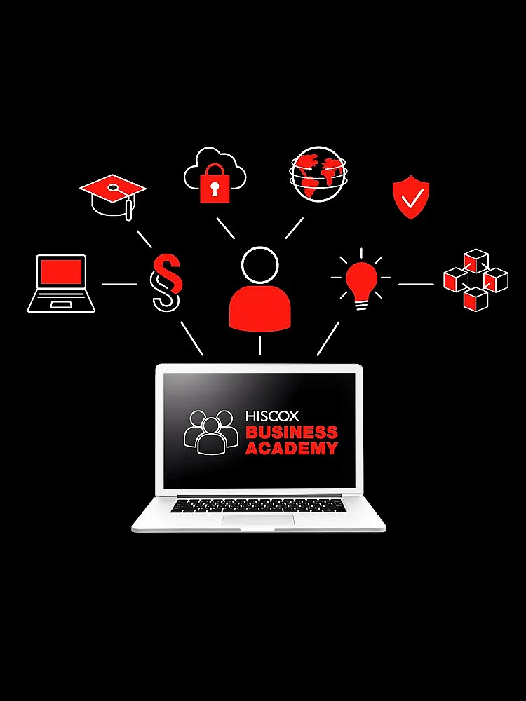 Ein Laptop zeigt "HISCOX BUSINESS ACADEMY" und Symbole für verschiedene Geschäftsthemen.